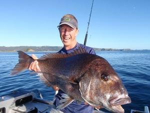 Matt Watson holds tight to one of his prized catches